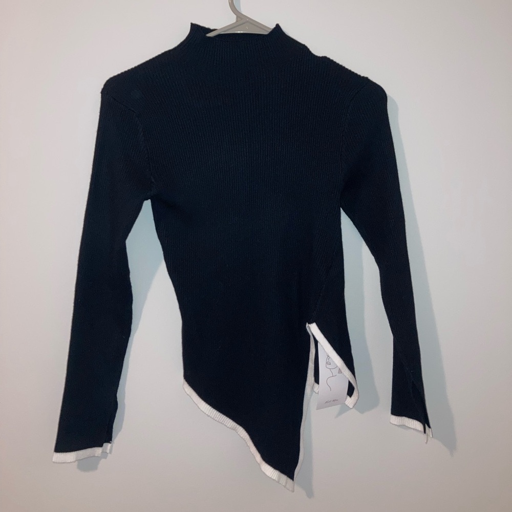 Elegant Black and White Sweater with Asymmetrical Hem